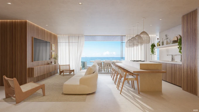 Interior de um apartamento no Manami Ocean Living Guarapari mostrando sala de estar integrada à cozinha gourmet e varanda com vista para o mar.