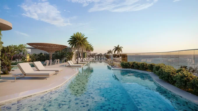 Piscina de luxo com borda infinita em prédio de alto padrão, representando o mercado imobiliário Enseada Azul Guarapari.